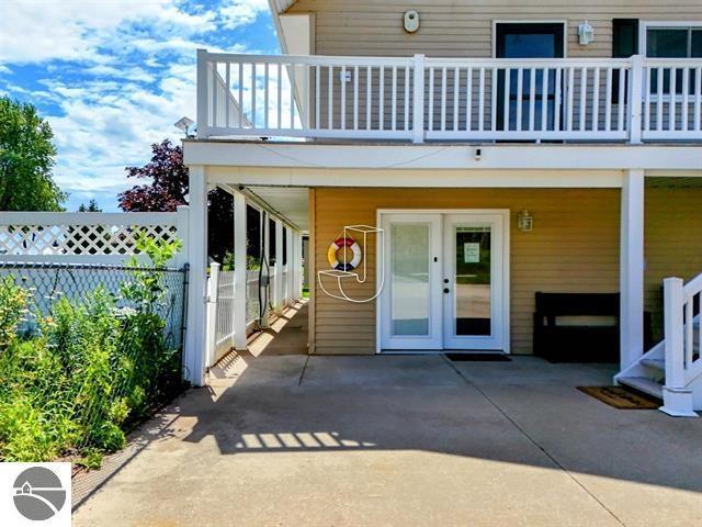 entrance to property with a patio, a balcony, and french doors