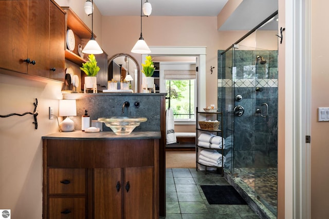 bathroom featuring sink, decorative backsplash, a shower with door, and tile patterned floors