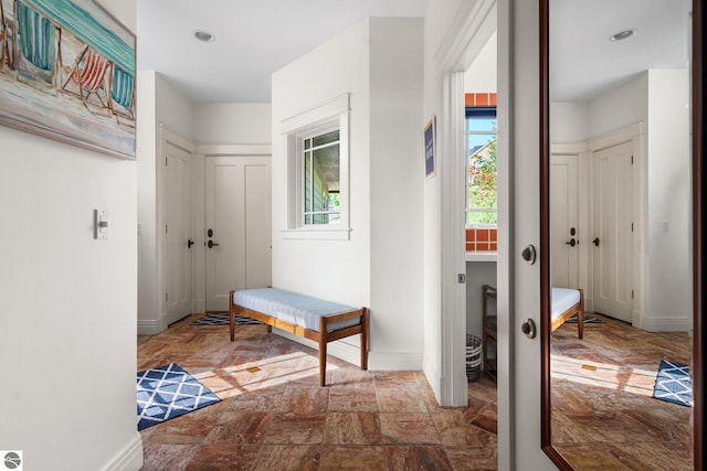 hallway featuring plenty of natural light