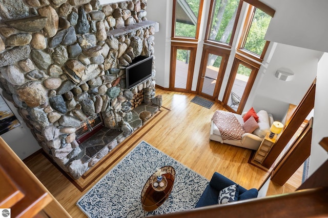 living room featuring hardwood / wood-style flooring and a high ceiling