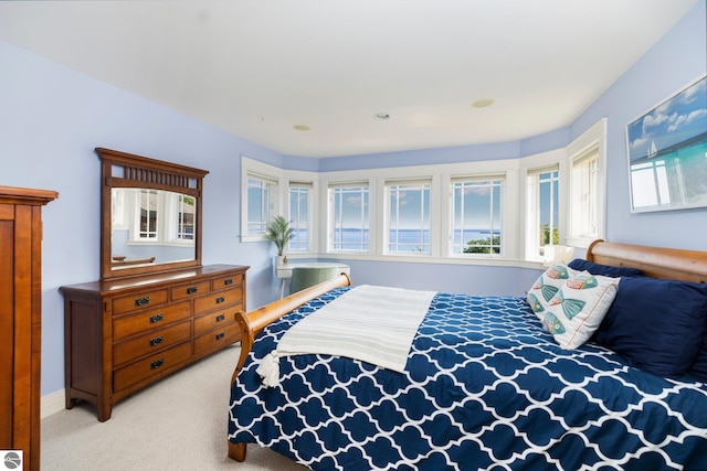 bedroom featuring light carpet