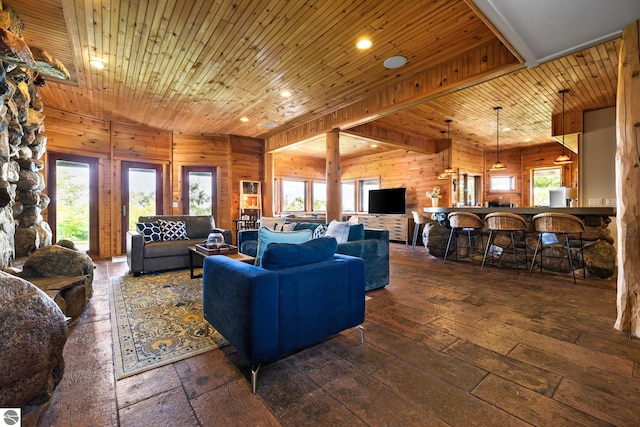 living room with wooden walls, wooden ceiling, and dark hardwood / wood-style floors