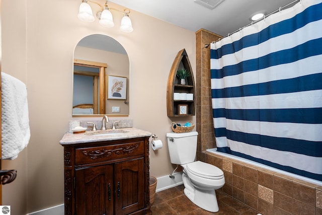 bathroom with vanity, toilet, and tile patterned flooring