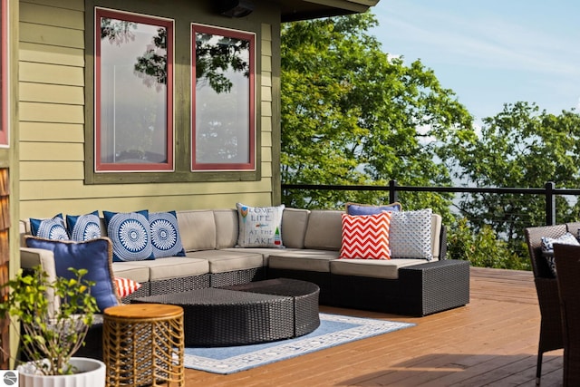 wooden deck featuring outdoor lounge area