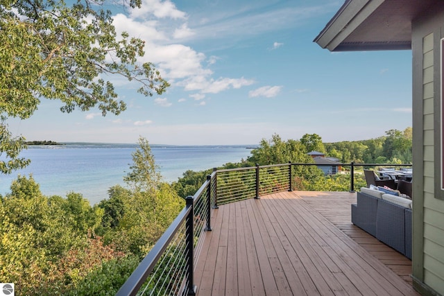 deck featuring a water view