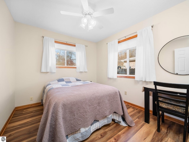 bedroom featuring hardwood / wood-style floors and ceiling fan