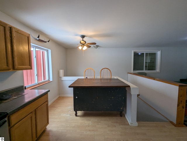 kitchen with ceiling fan and light wood-type flooring