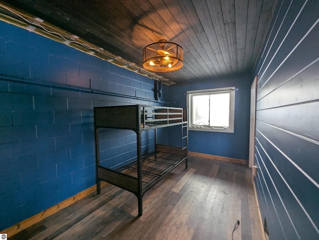 unfurnished bedroom featuring wooden ceiling and dark hardwood / wood-style flooring