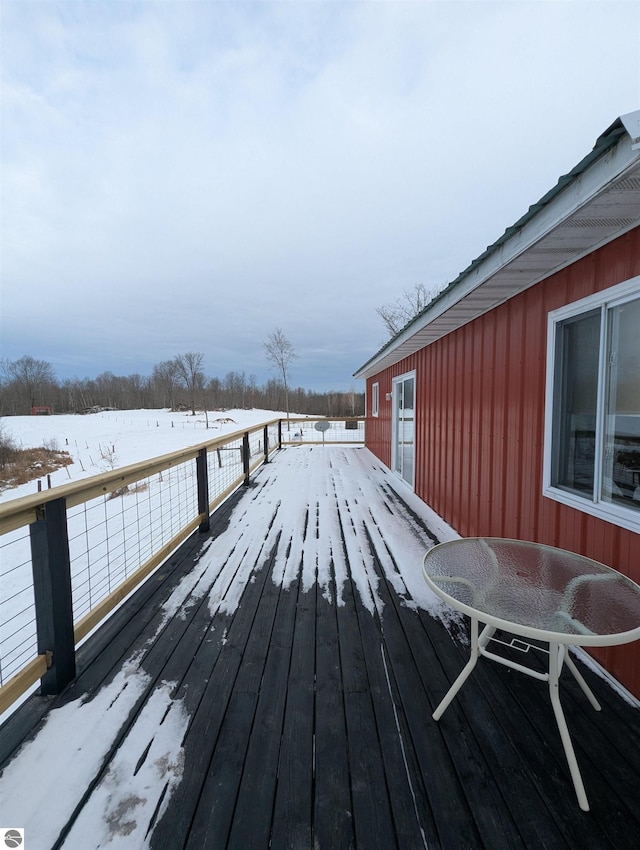 view of snow covered deck