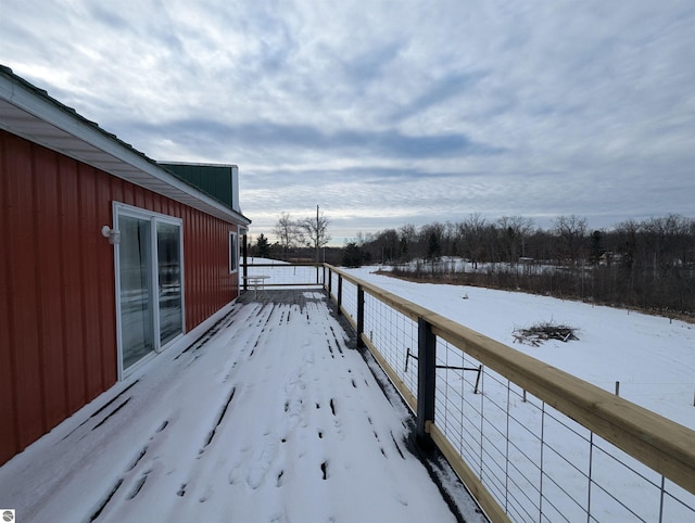 view of snow covered deck