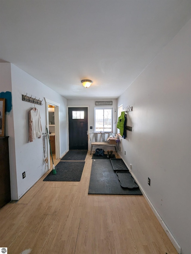 entryway with light hardwood / wood-style flooring