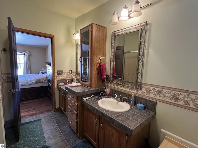 bathroom with vanity and tile patterned flooring