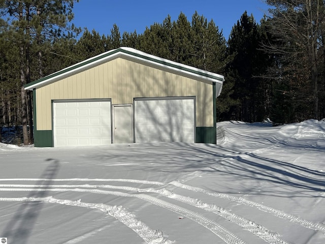 view of snow covered garage