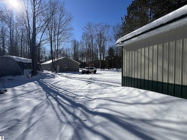 view of yard covered in snow