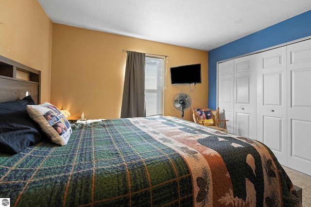 carpeted bedroom with a closet