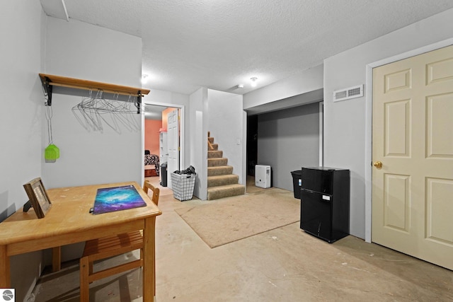 basement with a textured ceiling