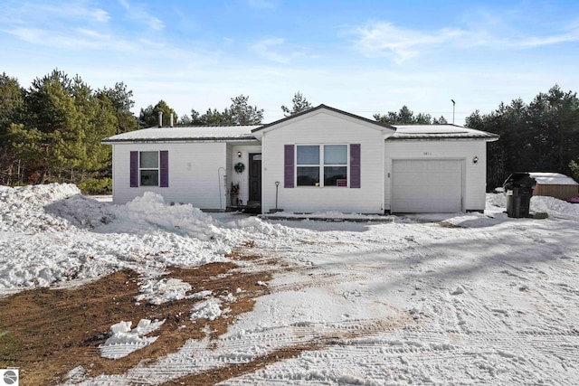 ranch-style house featuring a garage