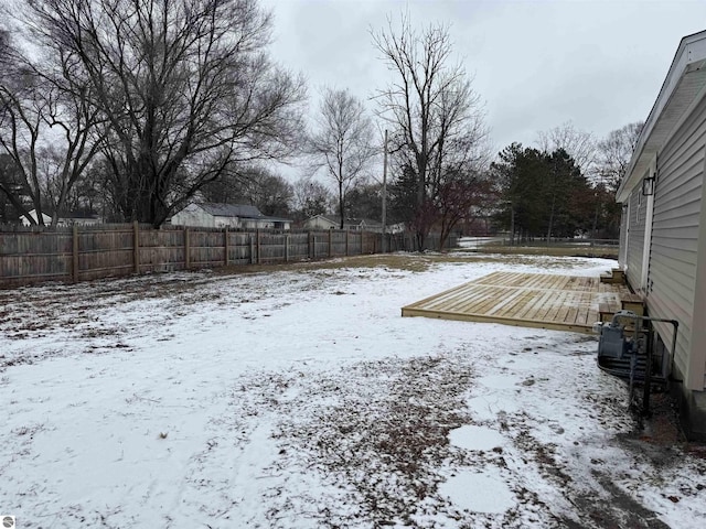 view of yard layered in snow