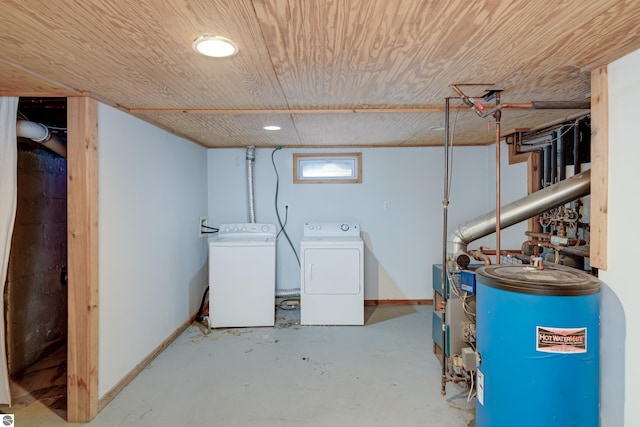 basement with wood ceiling, washer and dryer, and gas water heater