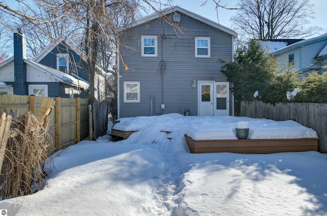 view of snow covered house