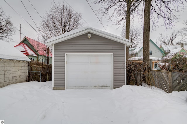 view of snow covered garage