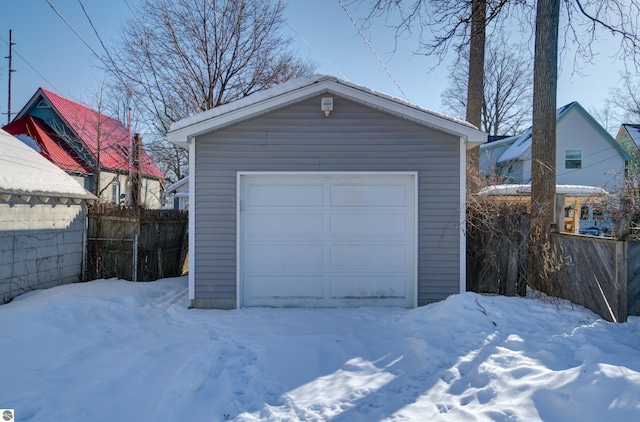 view of snow covered garage