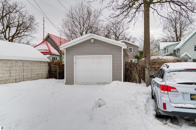 view of snow covered garage