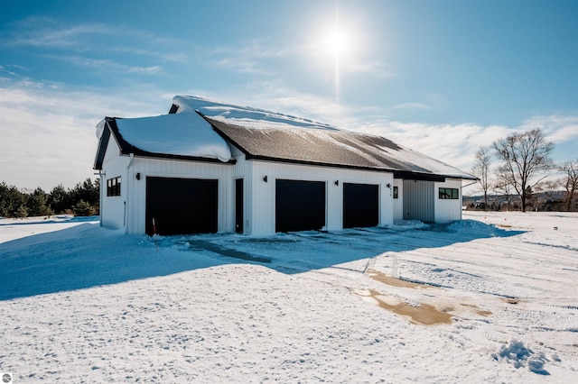 view of snow covered garage