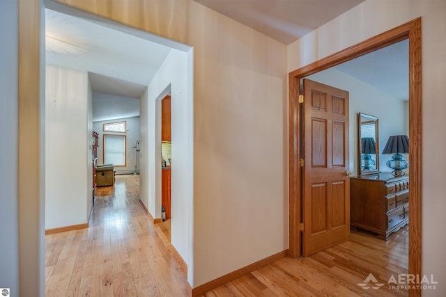 hall with light hardwood / wood-style flooring