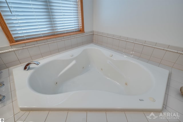 bathroom with tiled bath