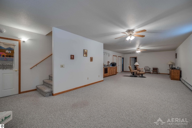 interior space with carpet floors and ceiling fan