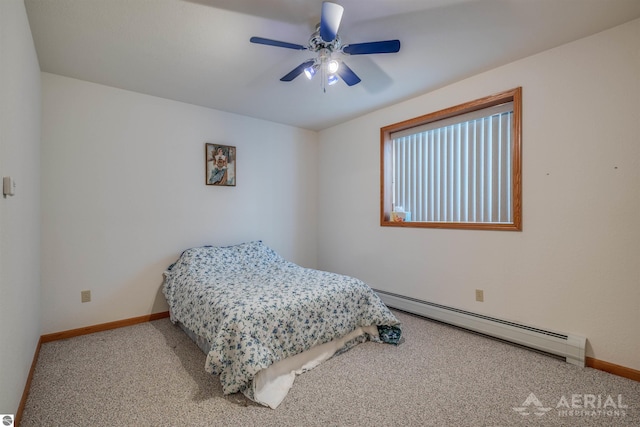 carpeted bedroom featuring baseboard heating and ceiling fan