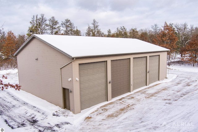 view of snow covered garage