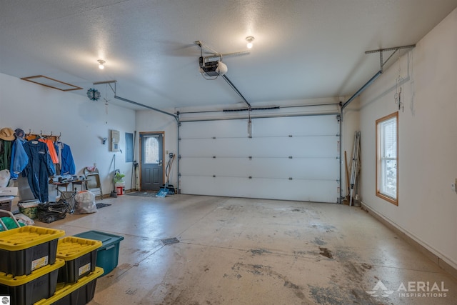 garage with a garage door opener and electric panel