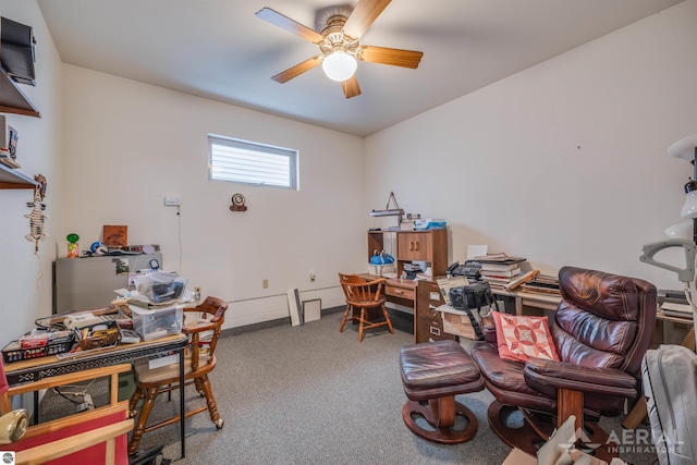 carpeted office space with ceiling fan