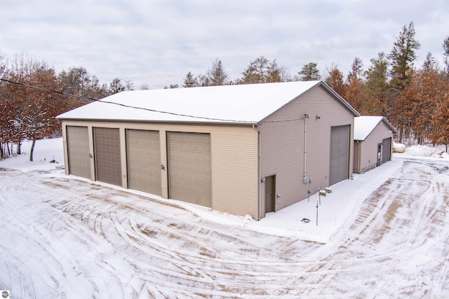 view of snow covered garage