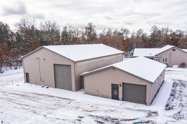 view of snow covered garage