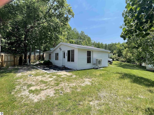 back of property featuring a lawn