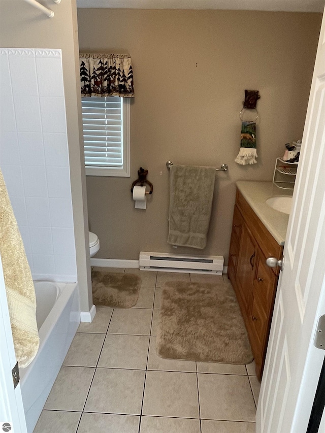 bathroom with toilet, a baseboard radiator, vanity, a bathing tub, and tile patterned flooring