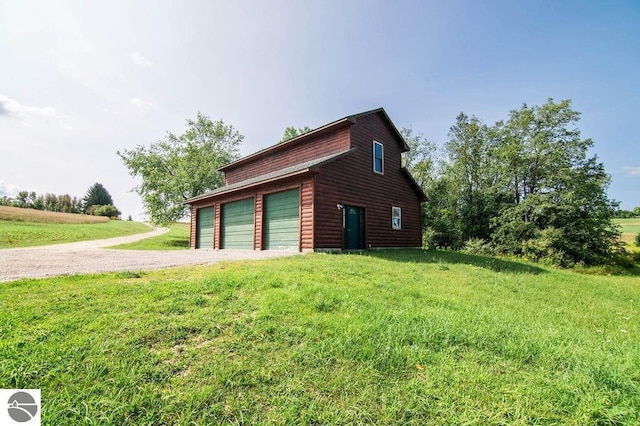 garage featuring a yard