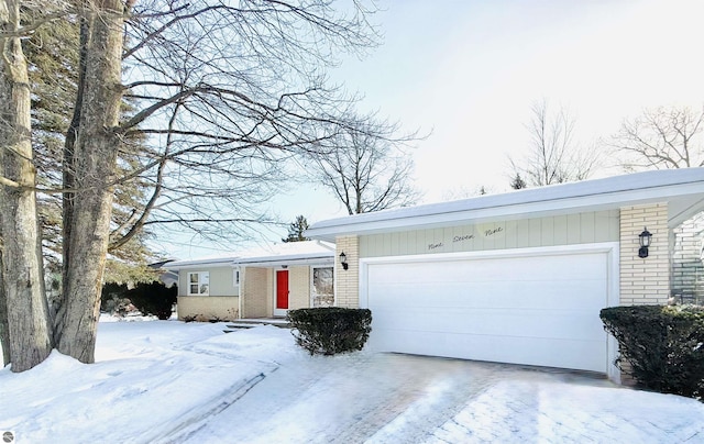 ranch-style house featuring a garage