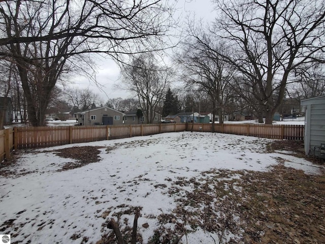 view of yard covered in snow