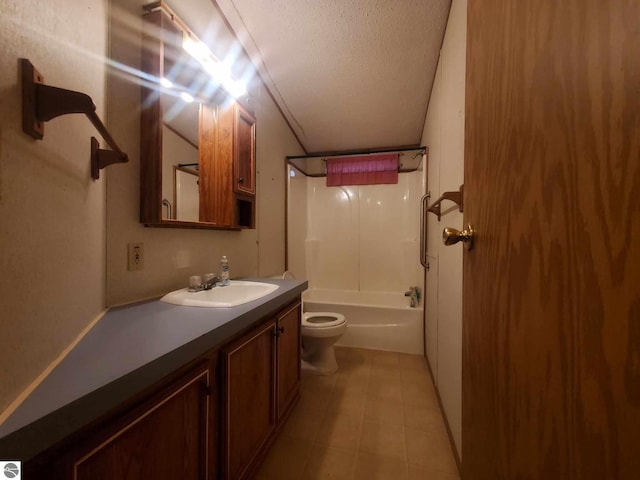 full bathroom featuring bathing tub / shower combination, tile patterned flooring, vanity, a textured ceiling, and toilet