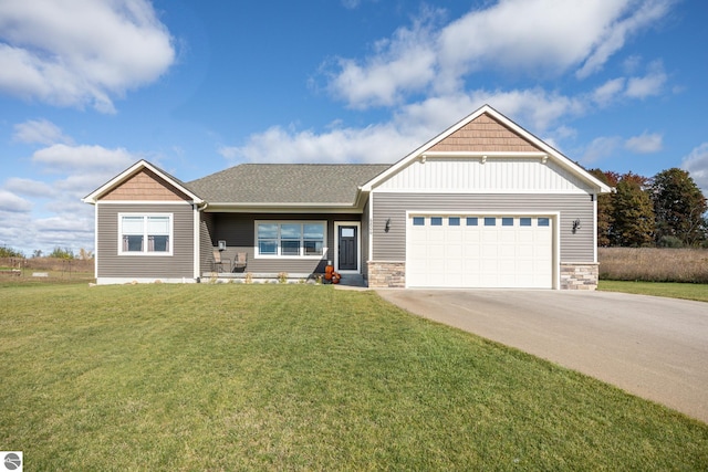 view of front of property with a garage and a front yard