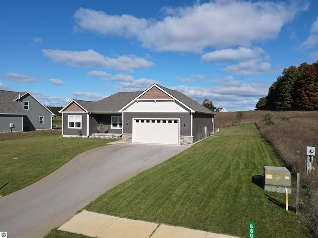 view of front of home with a garage and a front lawn