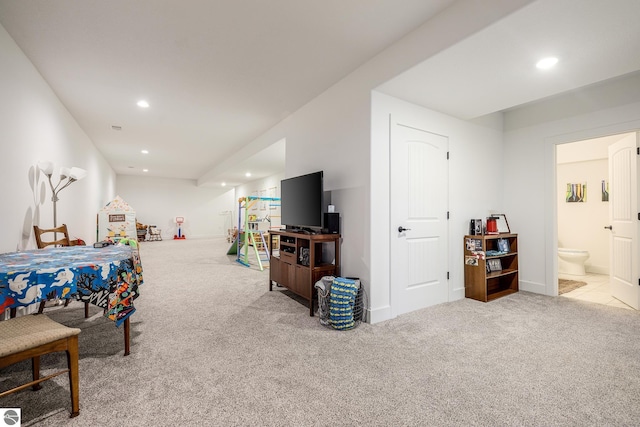 game room with light colored carpet