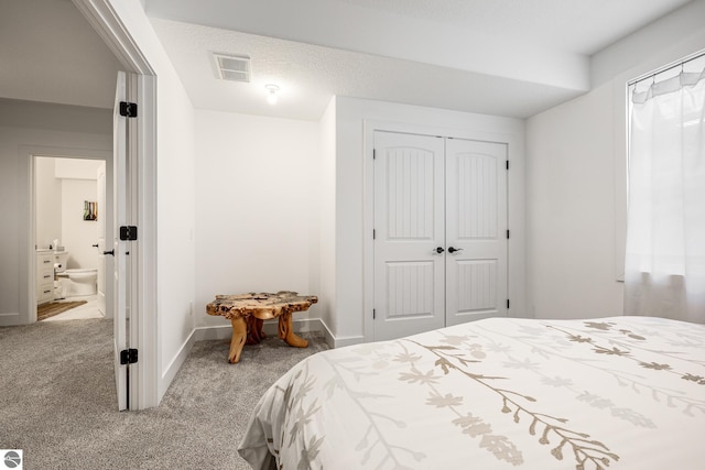 bedroom with carpet floors and a closet