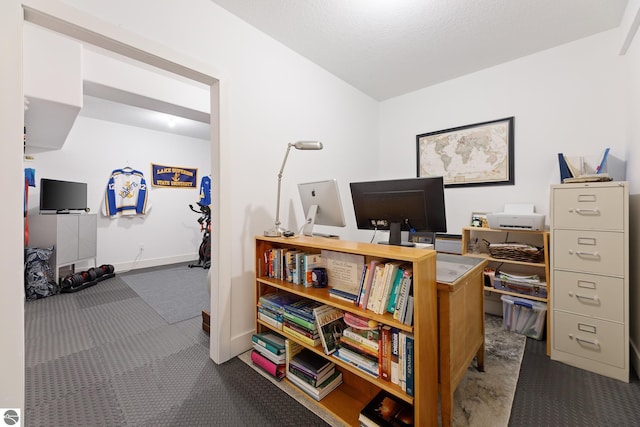 office space with dark colored carpet