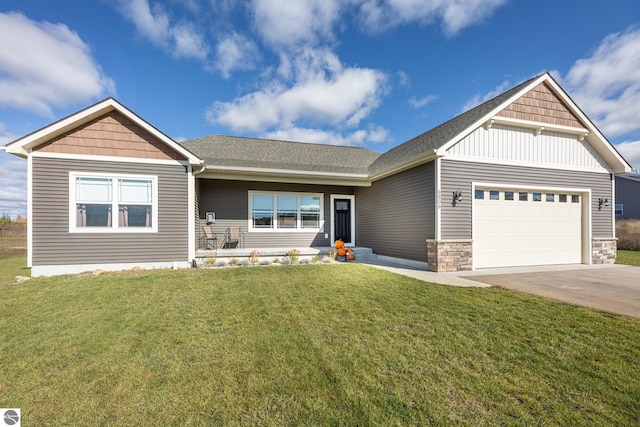 view of front of house featuring a garage and a front lawn