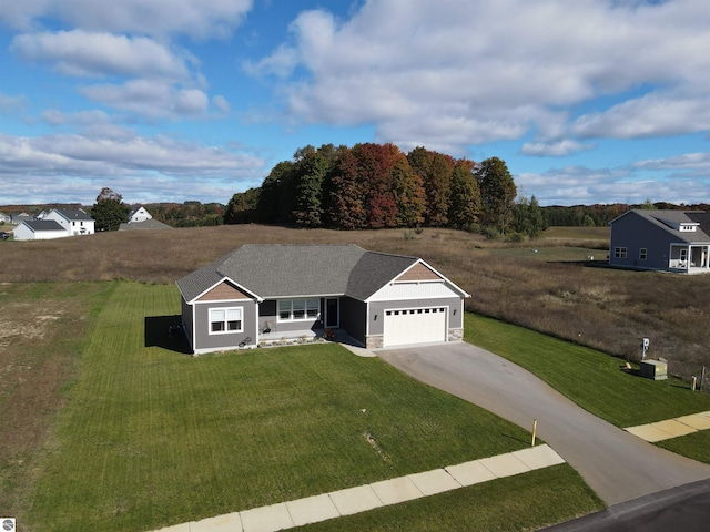 ranch-style home with a garage and a front yard